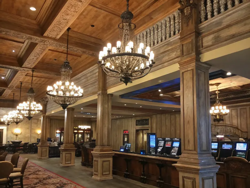 Casino interior featuring vintage chandeliers reclaimed wood and antique architectural elements